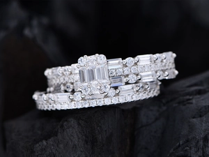 Macro view of S925 sterling silver baguette and round cut cluster diamond rings