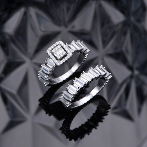 Modern S925 silver geometry rings set with square-cut zircon stones on a black background