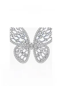 Detailed macro view of silver butterfly jewelry featuring micro-set sparkling diamonds