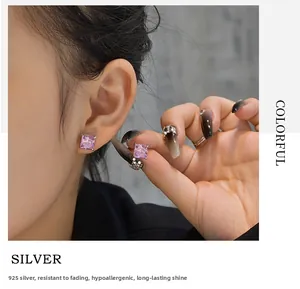 Detail of pink square-cut carbon diamond studs on 925 sterling silver earring