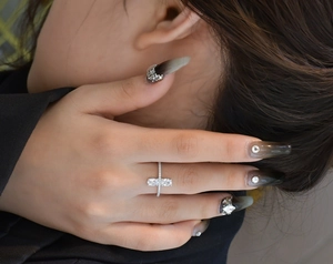 Close-up of double oval stones and pavé set S925 silver ring on model finger