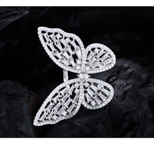 Macro view of sterling silver butterfly ring with intricate cubic zirconia pavé detailing