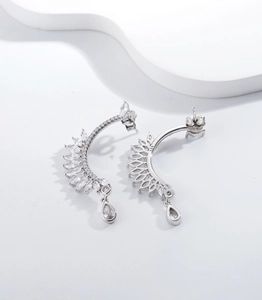Macro shot showing S925 hallmark on silver feather earring with marquise and drop zircons