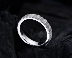 Detailed macro view of 925 silver stamp on 4mm triple-row micro-pave eternity ring