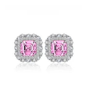 Macro view of square pink asscher cut halo earrings with marquise and round accents