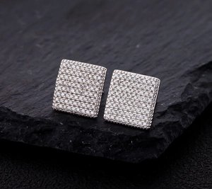 Macro shot of square S925 silver stud earrings with micro-paved sparkling cubic zirconia