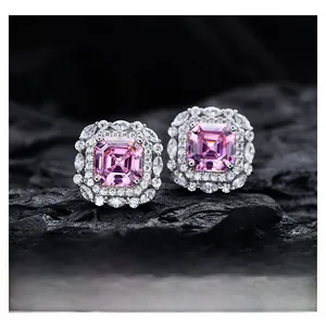 Macro shot of 925 silver halo stud earrings featuring Asscher cut pink carbon diamonds