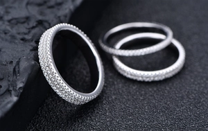 Macro view of three-piece 925 sterling silver eternity rings set with full pavé stones