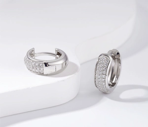 Close-up of S925 sterling silver hoop earrings with shimmering pavé set cubic zirconia