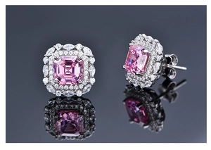 Macro shot of 925 silver halo stud earrings with pink Asscher cut high carbon diamonds