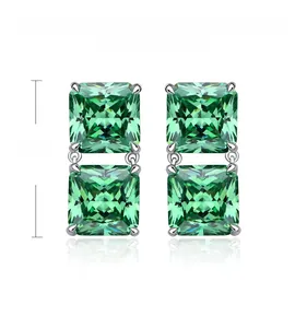 Detail of 22mm double square cut emerald green carbon diamond silver earrings