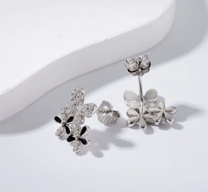 Macro shot of S925 sterling silver butterfly petal earrings with black enamel and zircons
