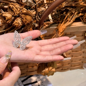 Detailed wide sterling silver butterfly ring with micro-p鑲 cubic zirconia on hand