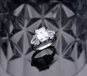 Macro shot of S925 silver ring featuring emerald cut high-carbon diamond and engraving