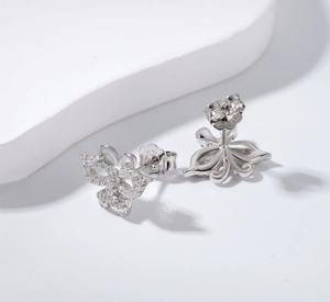 Detail of S925 sterling silver butterfly earrings with sparkling cubic zirconia pavé