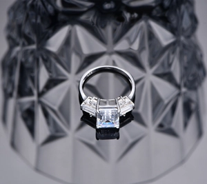 Macro shot of S925 hallmark on silver ring band with emerald-cut high carbon diamond