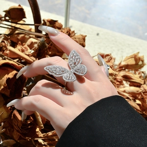 Exaggerated silver butterfly ring with micro-paved crystals and hollow-out wings