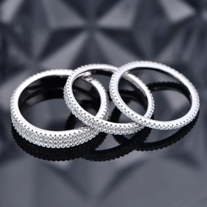 Three 925 sterling silver eternity rings with 1, 2, and 3 rows of cubic zirconia