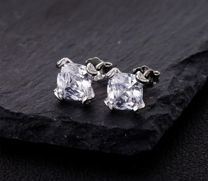 Macro shot of S925 sterling silver hallmark and intricate four-prong setting on studs