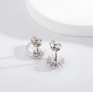 Detailed macro shot of S925 sterling silver moon and star studs with hallmark
