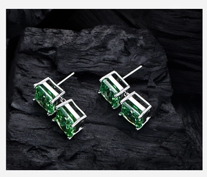 Macro detail of S925 silver stud earrings with double layered green ice cut carbon diamonds