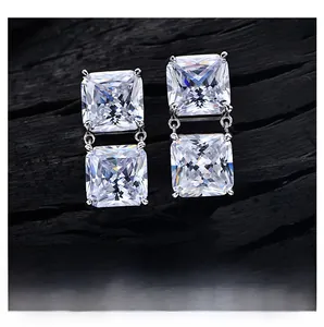 Macro shot of 8ct radiant cut sparkling high carbon diamond drop earrings in silver