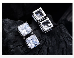 Macro view of S925 sterling silver stamp on square ice-cut carbon diamond earrings