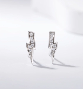 Macro detail of lightning bolt stud earrings with white zirconia in S925 sterling silver