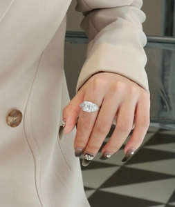 Close-up of 8x10mm emerald cut ring worn on hand, featuring luxury S925 silver setting