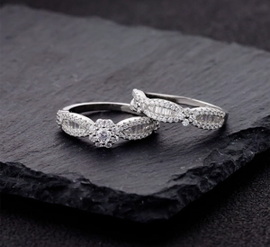 Macro shot of silver sterling nesting rings with snowflake petals and micro-pave diamonds