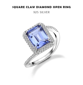 Detailed macro view of 925 sterling silver ring with emerald cut blue gemstone