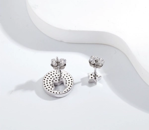 Detail of S925 sterling silver stamp and intricate mesh back on asymmetric star earrings