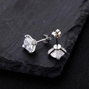 Princess cut cubic zirconia stud earrings in 925 silver on black stone display