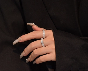 Macro view of sterling silver snowflake rings with micro-pave cubic zirconia on a model