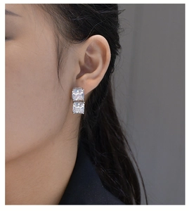Detail of S925 sterling silver studs with square-cut ice flower carbon diamonds on model