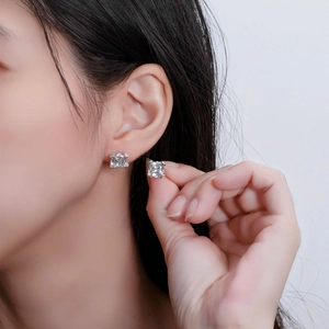 Classic 925 silver square cut stud earrings with four-prong setting on a female model