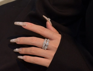 Detailed view of sterling silver snowflake bridal ring set with micro-pave crystals