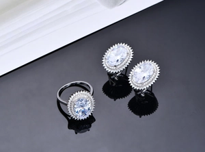 Macro shot of oval halo jewelry set with sparkling crystals in vintage silver finish