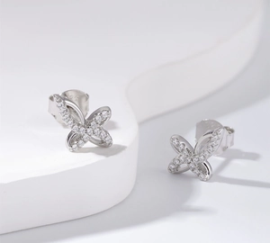 Macro view of 925 sterling silver butterfly stud earrings with sparkling cubic zirconia