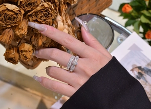 Macro shot of silver stacking ring set with snowflake micro-pave and round center stone