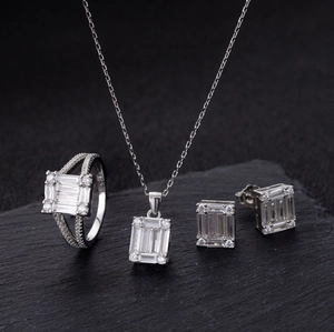 Close-up of S925 sterling silver jewelry set featuring emerald-cut cubic zirconia