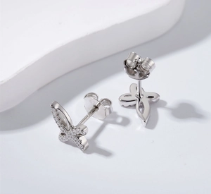 Close-up of S925 sterling silver stamp on butterfly earrings with cubic zirconia