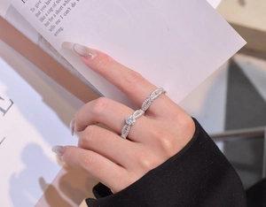 Detailed view of silver stackable rings featuring marquise-cut frames and micro-pave stones