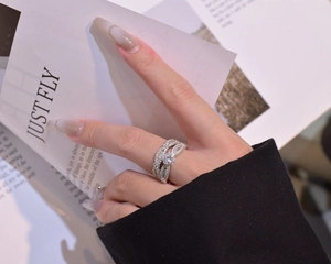 Close-up of snowflake micro-pave silver rings showing the intricate diamond patterns