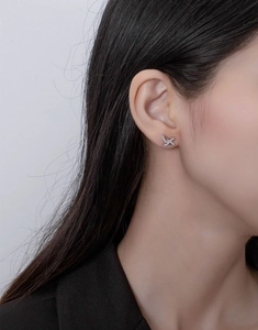 Close-up of S925 sterling silver S-shaped stud earring with micro-set cubic zirconia