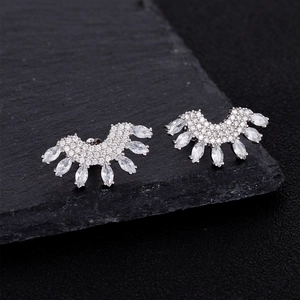 Elegant 925 sterling silver fan-shaped stud earrings with marquise-cut crystals on dark rock