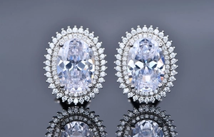 Macro detail of oval cut crystal earrings with double halo setting in S925 silver
