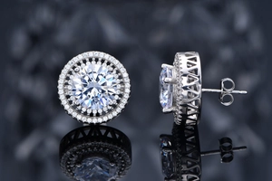 Macro view of 10mm round cut sparkling earrings with double halo moissanite details