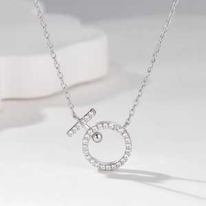 Elegant silver pendant necklace with zircon-encrusted circle and minimalist bead detail
