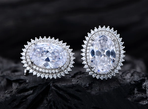 Close-up of S925 silver double halo oval stud earrings with brilliant cut high carbon diamonds